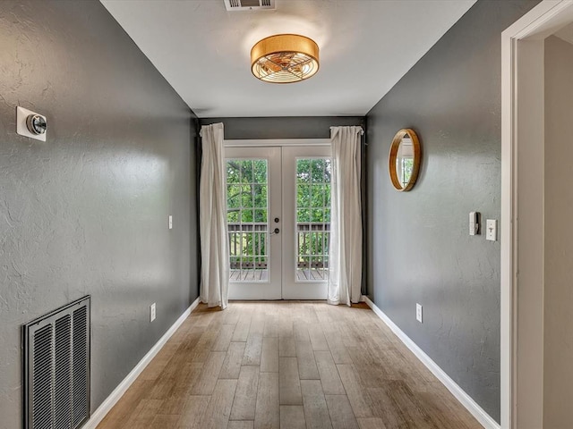 2809 Morgan Trace Rd, Yukon, OK 73099 - entryway featuring french doors, wood finished floors, and baseboards