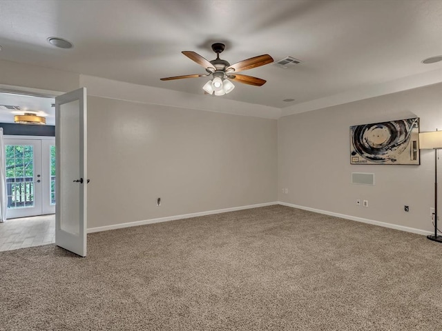 2809 Morgan Trace Rd, Yukon, OK 73099 - unfurnished room with carpet, ceiling fan, baseboards, and french doors