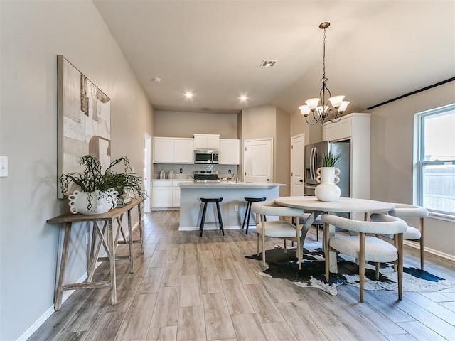 3721 Central Park Dr, Moore, OK 73160 - dining space featuring light wood-style flooring, a chandelier, baseboards, and recessed lighting