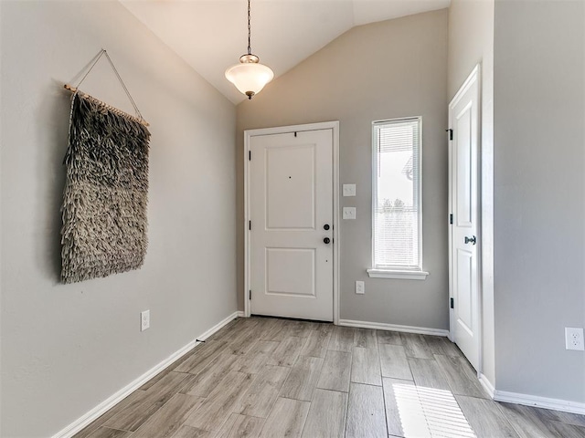 3721 Central Park Dr, Moore, OK 73160 - foyer entrance with light wood-type flooring, lofted ceiling, and baseboards