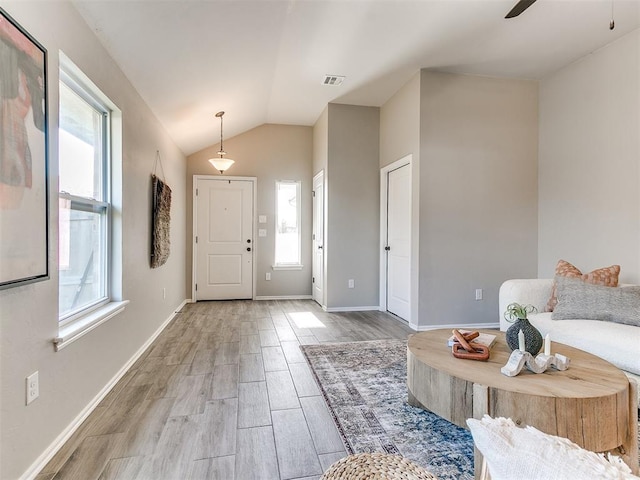 3721 Central Park Dr, Moore, OK 73160 - foyer with light wood-style flooring, lofted ceiling, baseboards, and ceiling fan