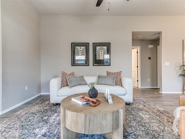 3721 Central Park Dr, Moore, OK 73160 - living area featuring wood finished floors, baseboards, and ceiling fan