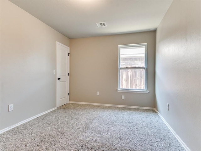 3721 Central Park Dr, Moore, OK 73160 - spare room featuring carpet and baseboards
