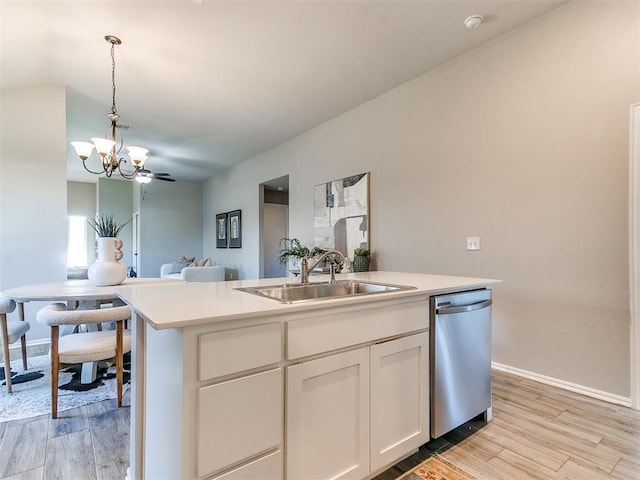 3721 Central Park Dr, Moore, OK 73160 - kitchen with dishwasher, a sink, a chandelier, open floor plan, and hanging light fixtures