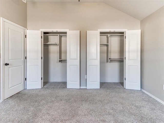 3721 Central Park Dr, Moore, OK 73160 - unfurnished bedroom featuring two closets, carpet floors, vaulted ceiling, and baseboards