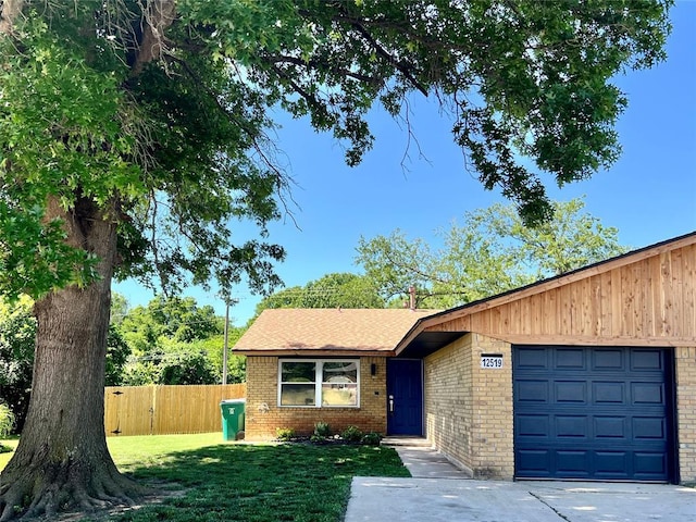 12519 SW 2nd St, Yukon, OK 73099 - view of front facade with brick siding and an attached garage