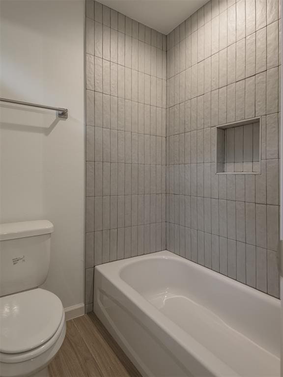 12125 SW 45th Ter, Mustang, OK 73064 - full bath with wood finished floors, baseboards, and toilet