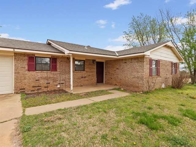 ranch-style home with brick siding, crawl space, a front yard, and a patio area