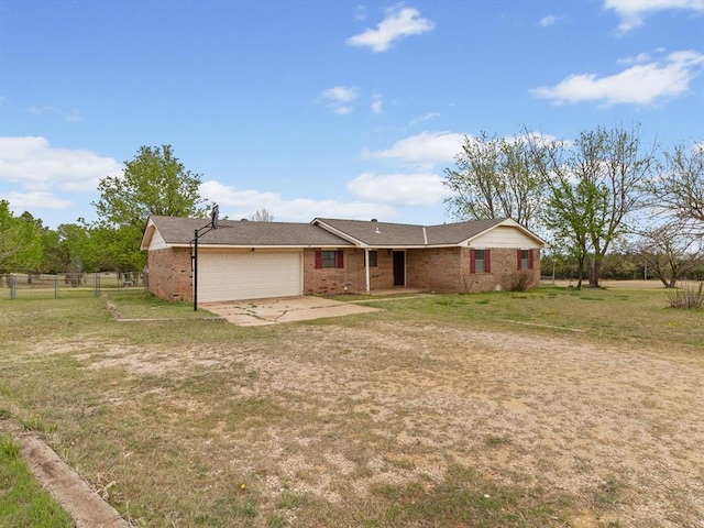 ranch-style home with driveway, a front yard, an attached garage, fence, and brick siding