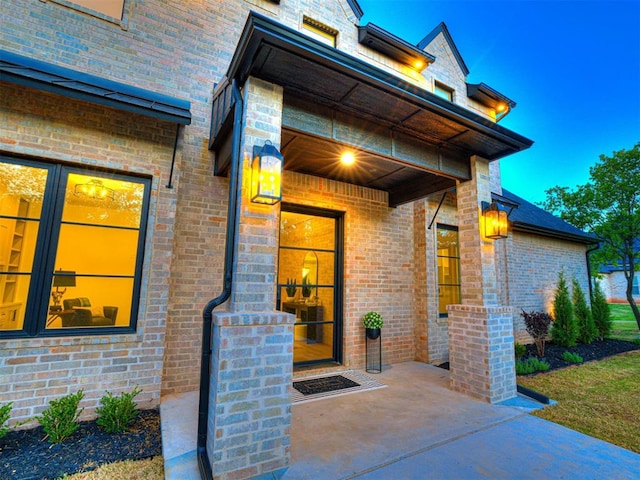 property entrance with brick siding