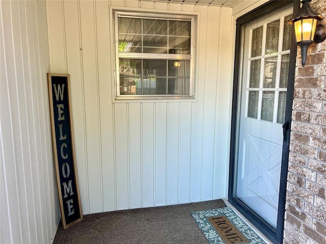 entrance to property with brick siding