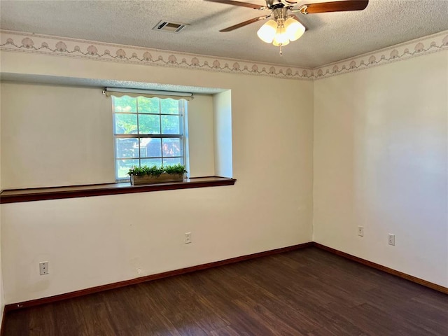 unfurnished room featuring wood finished floors, a textured ceiling, ceiling fan, and baseboards