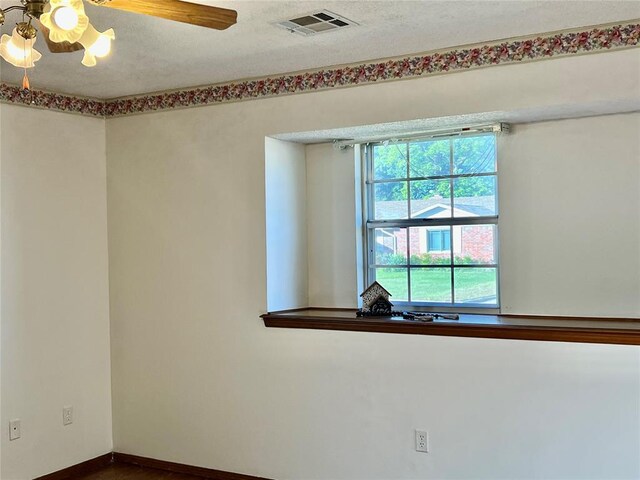 unfurnished room featuring baseboards