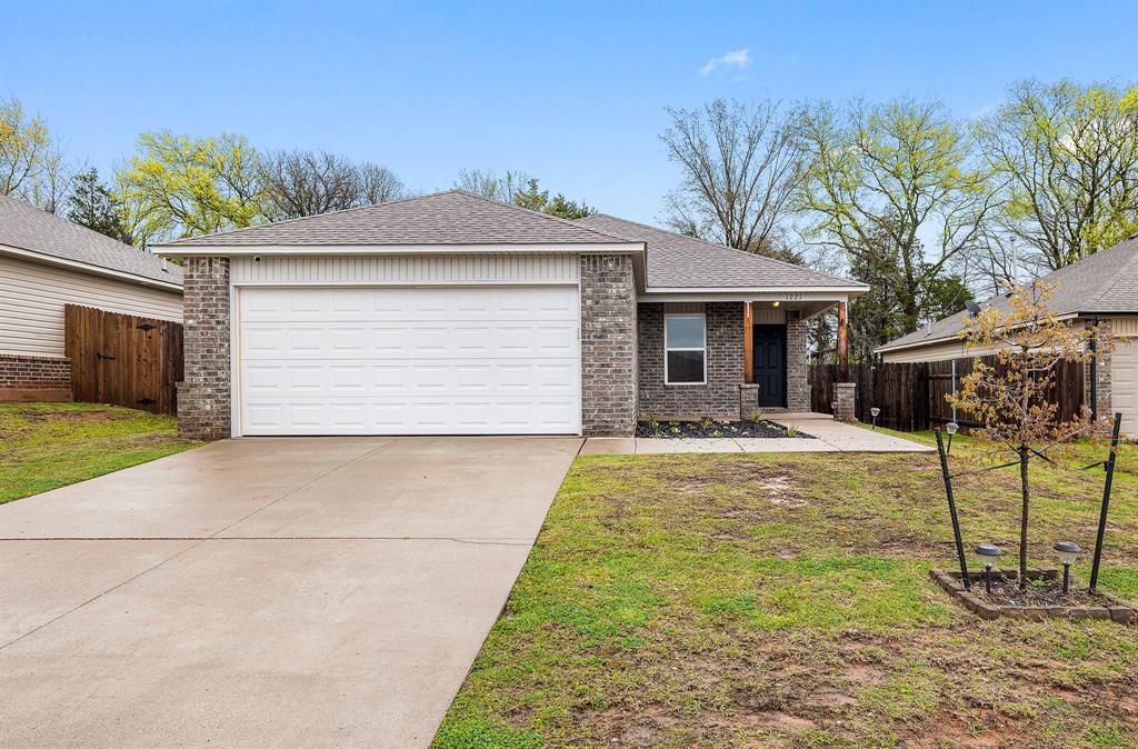 1221 Flint Way, Noble, OK 73068 - ranch-style house with brick siding, driveway, and fence