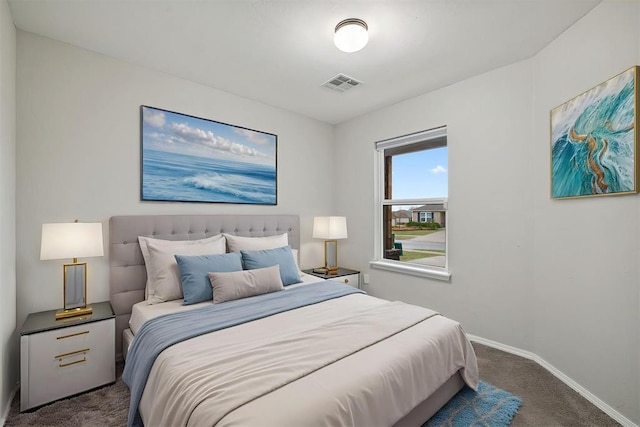 bedroom with carpet, visible vents, and baseboards