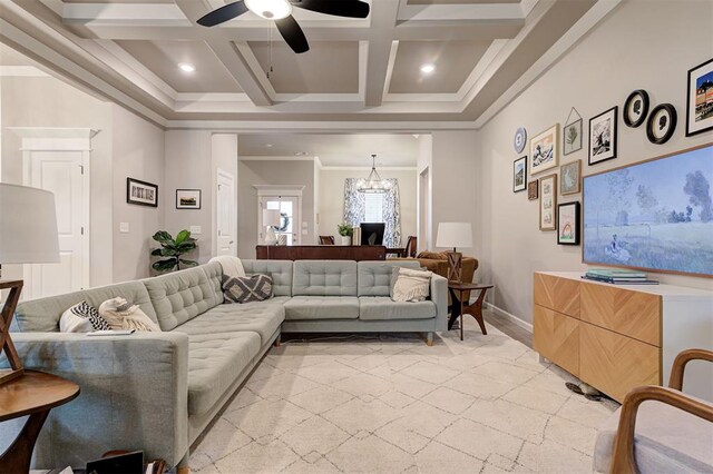 living area featuring baseboards, crown molding, beamed ceiling, ceiling fan with notable chandelier, and coffered ceiling