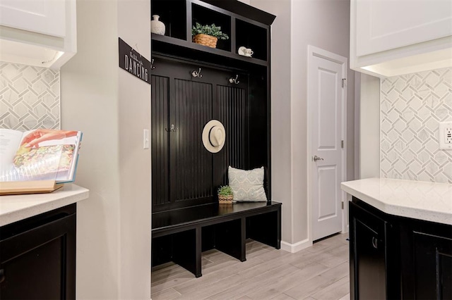 mudroom with light wood-style flooring