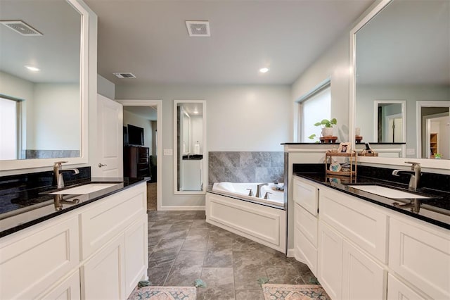bathroom featuring a sink and visible vents