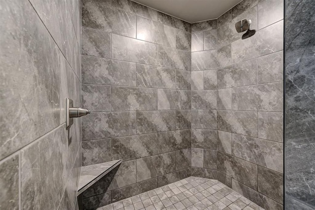 full bathroom featuring a tile shower