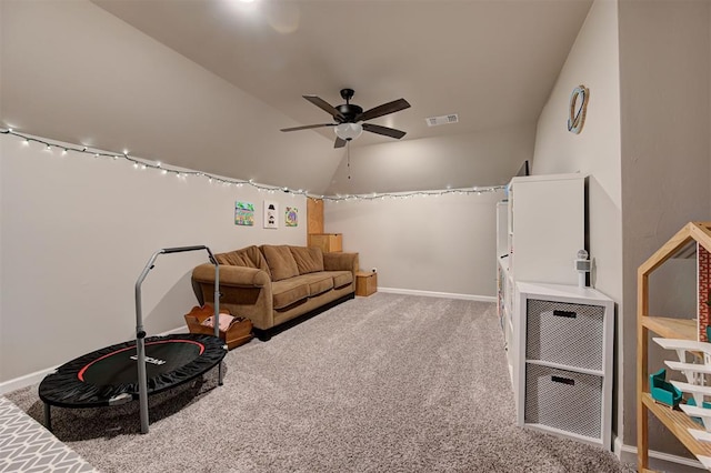 interior space with visible vents, baseboards, vaulted ceiling, and ceiling fan