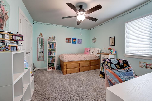 carpeted bedroom featuring a ceiling fan