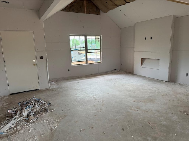 unfurnished living room with lofted ceiling