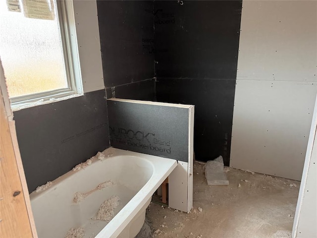 full bath with a garden tub