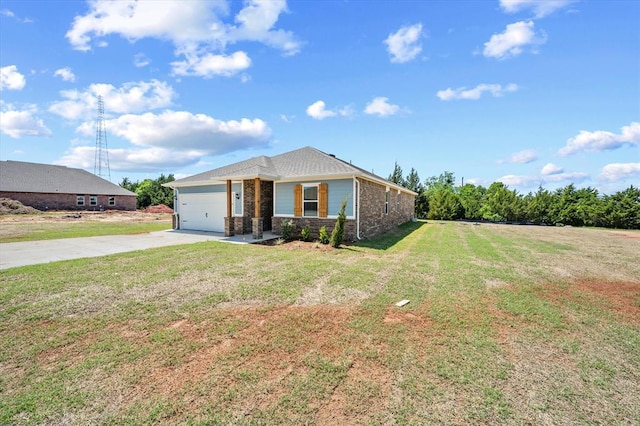 view of front of property with brick siding, driveway, a front lawn, and a garage