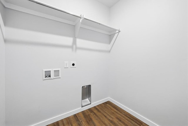 laundry area with laundry area, baseboards, hookup for a washing machine, dark wood-type flooring, and electric dryer hookup