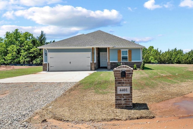 view of front of property featuring a garage, concrete driveway, a front lawn, and brick siding
