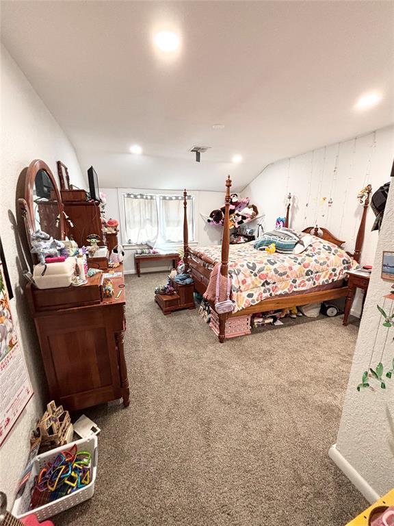 9737 NE State Highway 15, Shattuck, OK 32911 - carpeted bedroom featuring visible vents