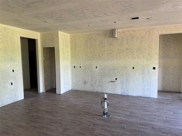 spare room with dark wood-type flooring