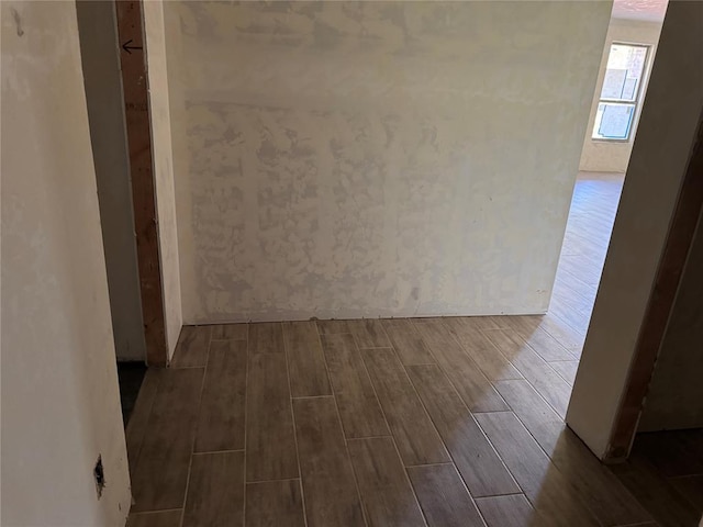 corridor featuring wood tiled floor