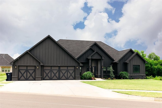 11813 NW 108th Pl, Yukon, OK 73099 - craftsman-style home featuring board and batten siding, an attached garage, a front lawn, driveway, and roof with shingles