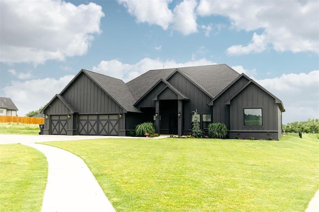 11813 NW 108th Pl, Yukon, OK 73099 - view of front facade featuring board and batten siding, an attached garage, roof with shingles, and driveway