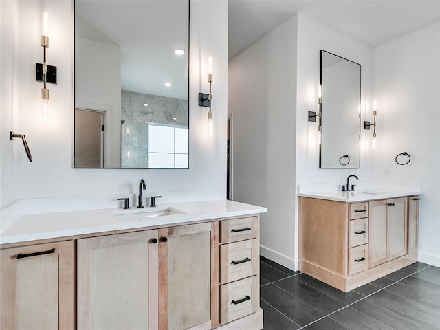 11813 NW 108th Pl, Yukon, OK 73099 - full bath featuring two vanities, a marble finish shower, tile patterned flooring, baseboards, and recessed lighting
