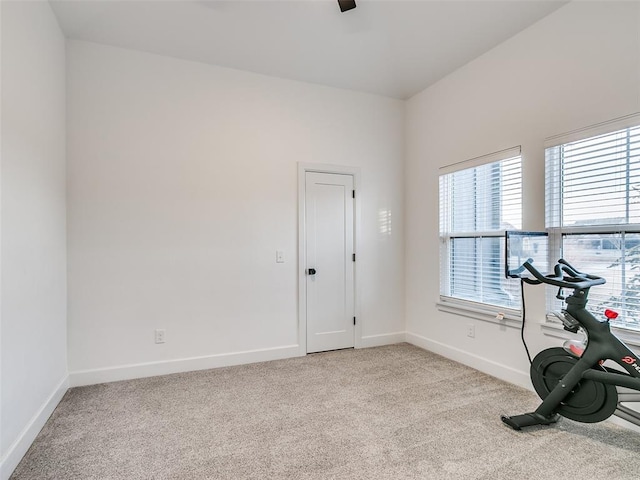 11813 NW 108th Pl, Yukon, OK 73099 - exercise room with light colored carpet, baseboards, and ceiling fan