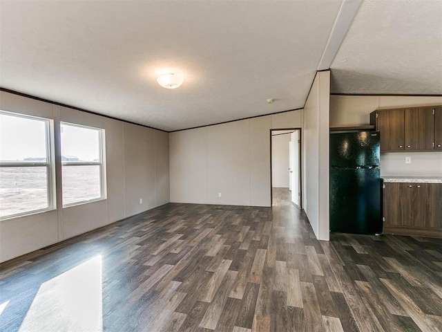 interior space featuring dark wood finished floors and a decorative wall