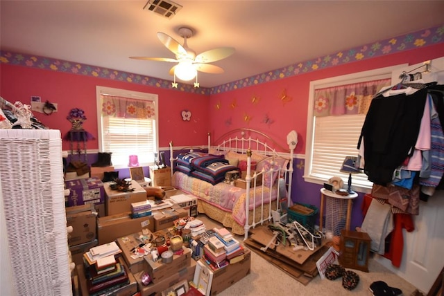 bedroom with visible vents and a ceiling fan