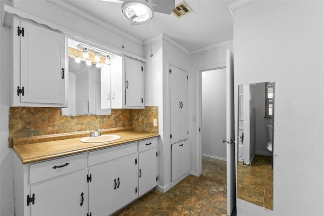 120 E 6th St, Stratford, OK 74872 - bathroom featuring vanity, tasteful backsplash, crown molding, ceiling fan, and visible vents