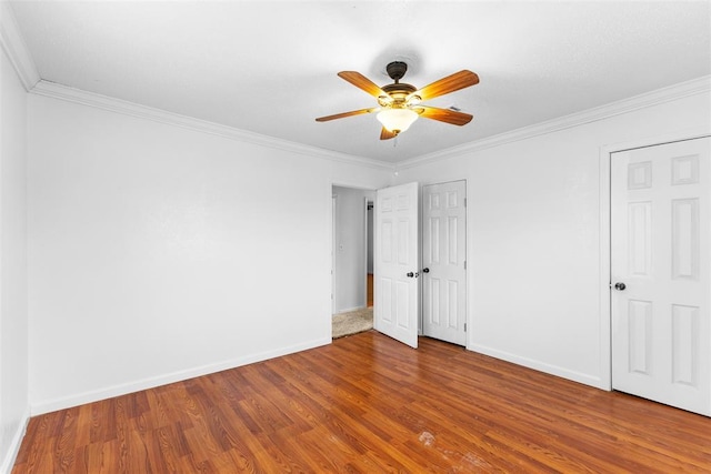120 E 6th St, Stratford, OK 74872 - unfurnished bedroom with baseboards, ornamental molding, and wood finished floors