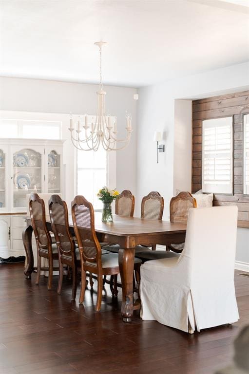 1412 NW 34th St, Oklahoma City, OK 73118 - dining space featuring a chandelier, dark wood-type flooring, and plenty of natural light