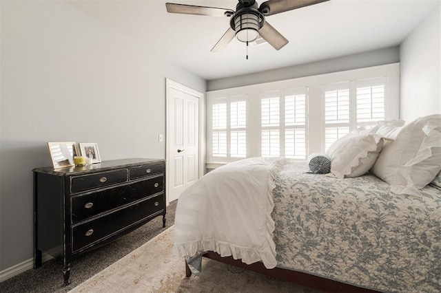 1412 NW 34th St, Oklahoma City, OK 73118 - carpeted bedroom with a closet, ceiling fan, baseboards, and multiple windows