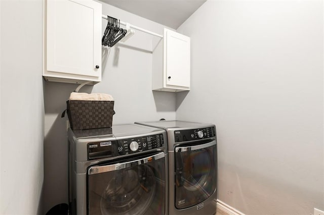 1412 NW 34th St, Oklahoma City, OK 73118 - clothes washing area with cabinet space, baseboards, and washing machine and dryer