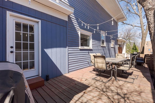 1412 NW 34th St, Oklahoma City, OK 73118 - wooden deck with outdoor dining space