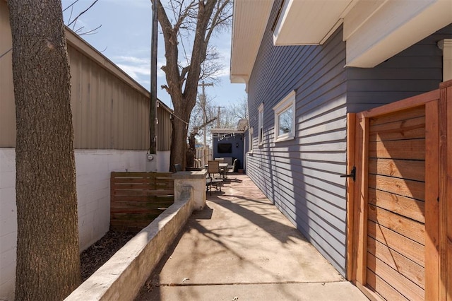 1412 NW 34th St, Oklahoma City, OK 73118 - view of side of property featuring outdoor dining space and a patio