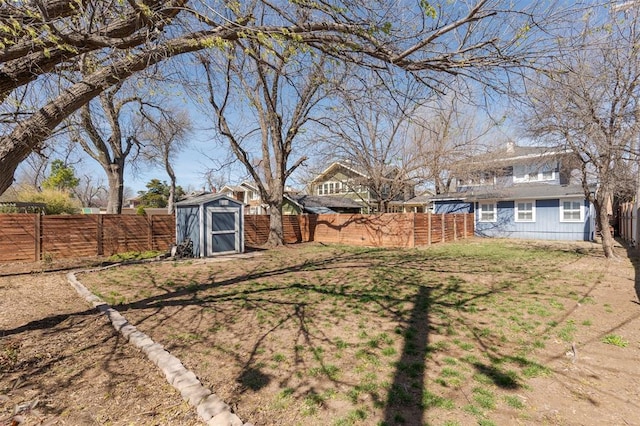 1412 NW 34th St, Oklahoma City, OK 73118 - view of yard featuring a fenced backyard, an outdoor structure, and a shed