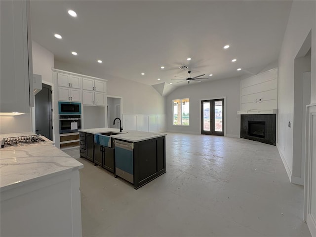 7120 NW 155th St, Edmond, OK 73013 - kitchen featuring a ceiling fan, built in microwave, a sink, dishwashing machine, and oven