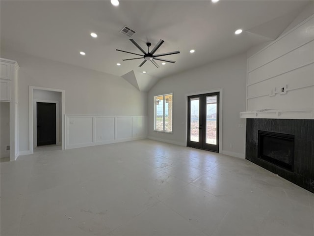 7120 NW 155th St, Edmond, OK 73013 - unfurnished living room with visible vents, lofted ceiling, a fireplace, recessed lighting, and french doors