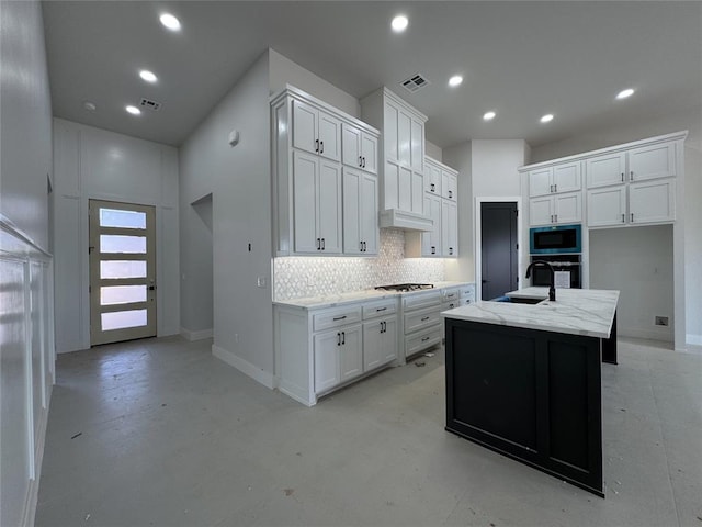 7120 NW 155th St, Edmond, OK 73013 - kitchen with finished concrete flooring, tasteful backsplash, a sink, stainless steel appliances, and white cabinetry